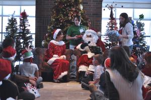 Tyler Stauffer photo: Santa delivered gifts to children at Christmas on Campus.